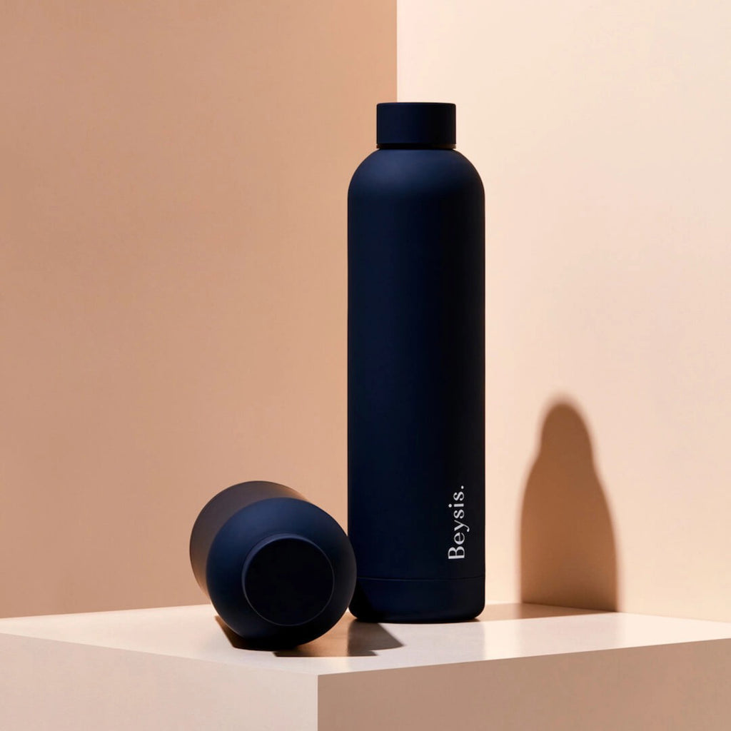Beysis Water Bottle on table.