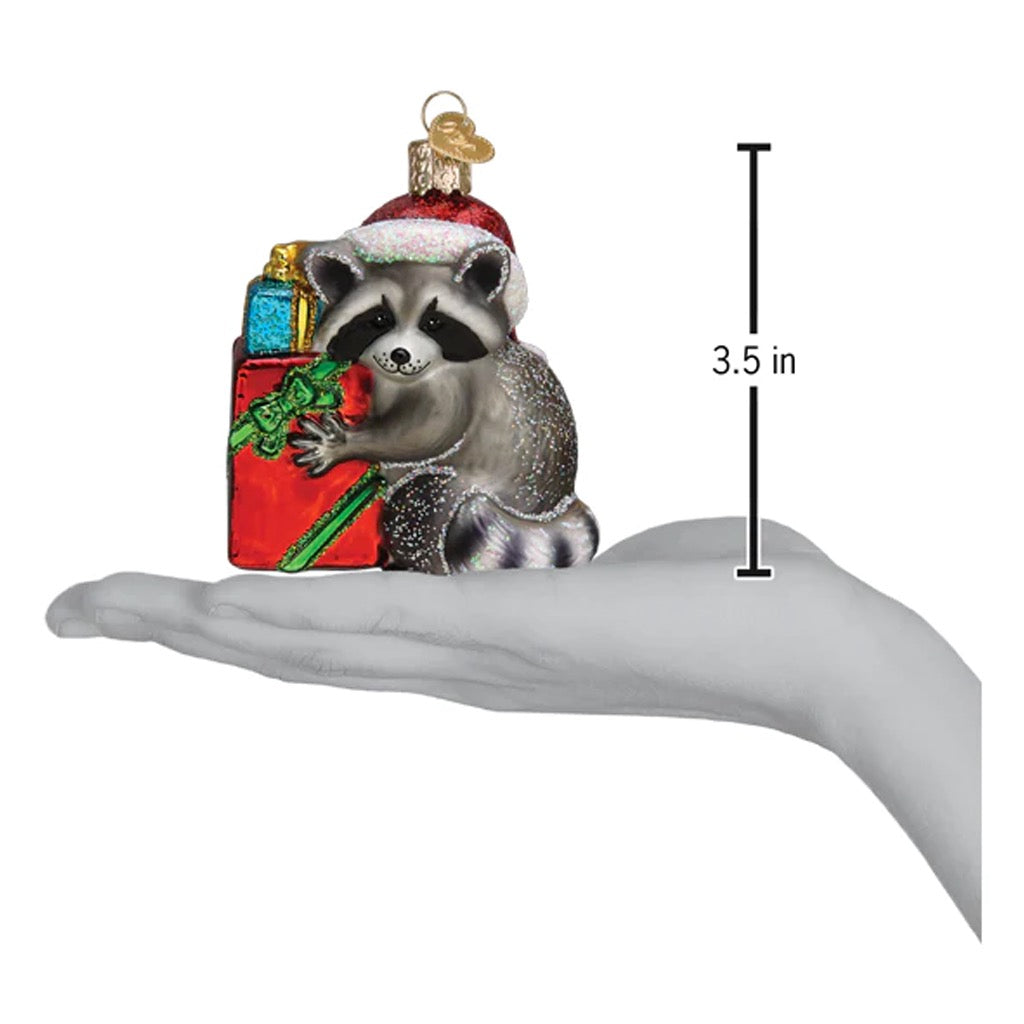 Christmas Bandit Raccoon Ornament in hand.