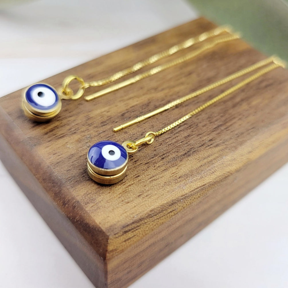 Close-up view of Evil Eye Threader Earrings.