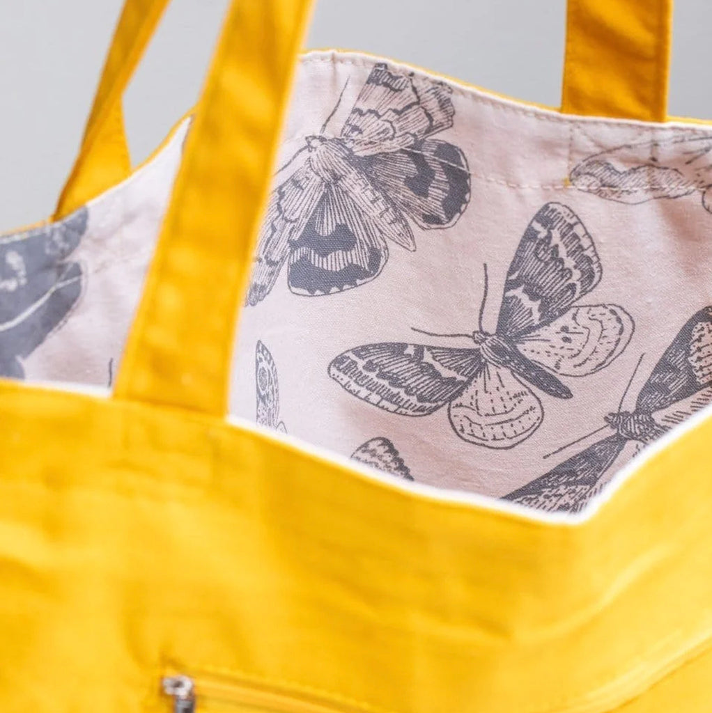 Close-up view of Moth Canvas Shoulder Tote.