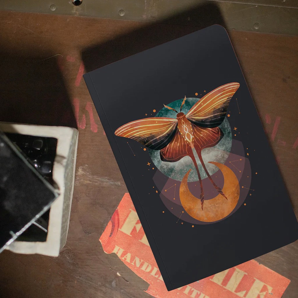 Cosmic Moth Layflat Notebook lifestyle.