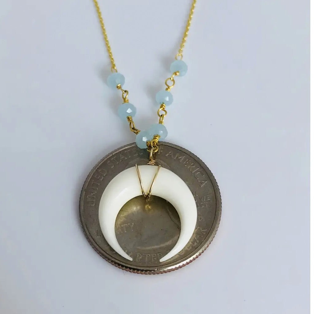 Double Horn Necklace Aquamarine on coin.