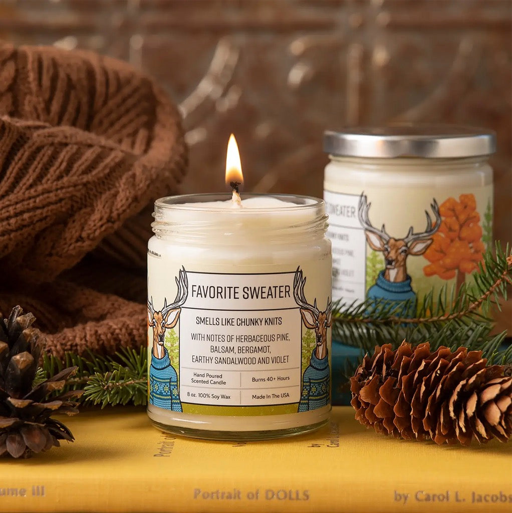 Favorite Sweater 8oz Soy Candle with candle burning.