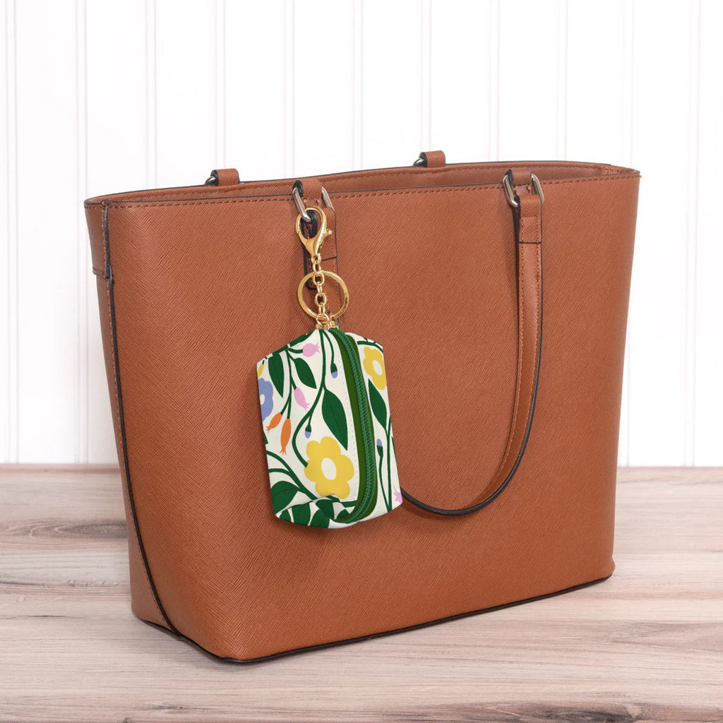 Floral Bliss Key Chain Pouch attached to bag.
