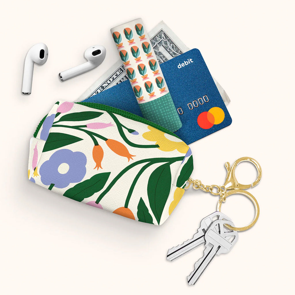Floral Bliss Key Chain Pouch with items spilling out.