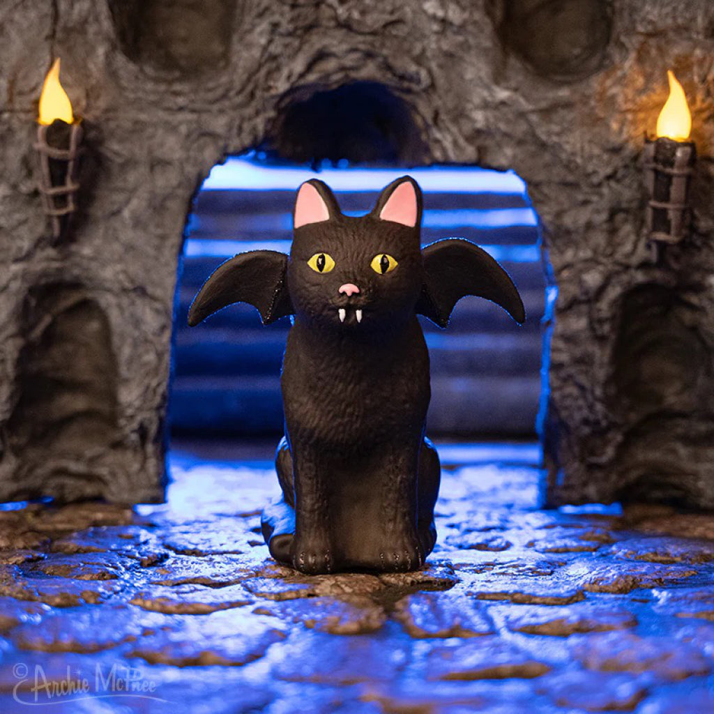 Goth Cat Ornament in cavern.