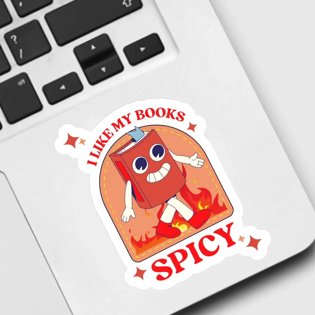 I Like My Books Spicy Sticker on computer.