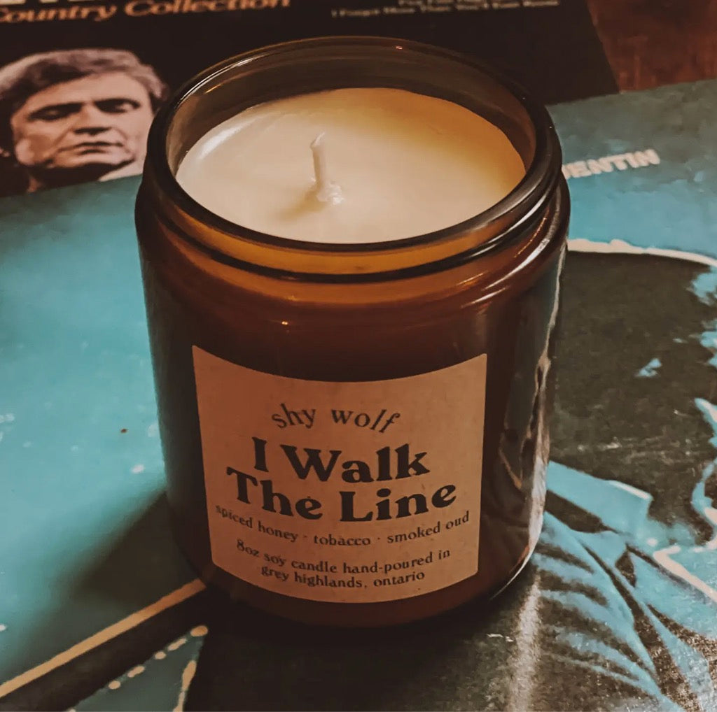I Walk the Line Candle 8oz Candle showing top and Johnny Cash record in background.