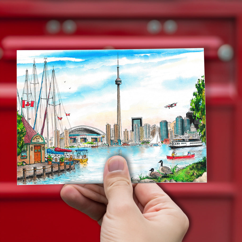 Island Skyline Toronto Postcard being held.