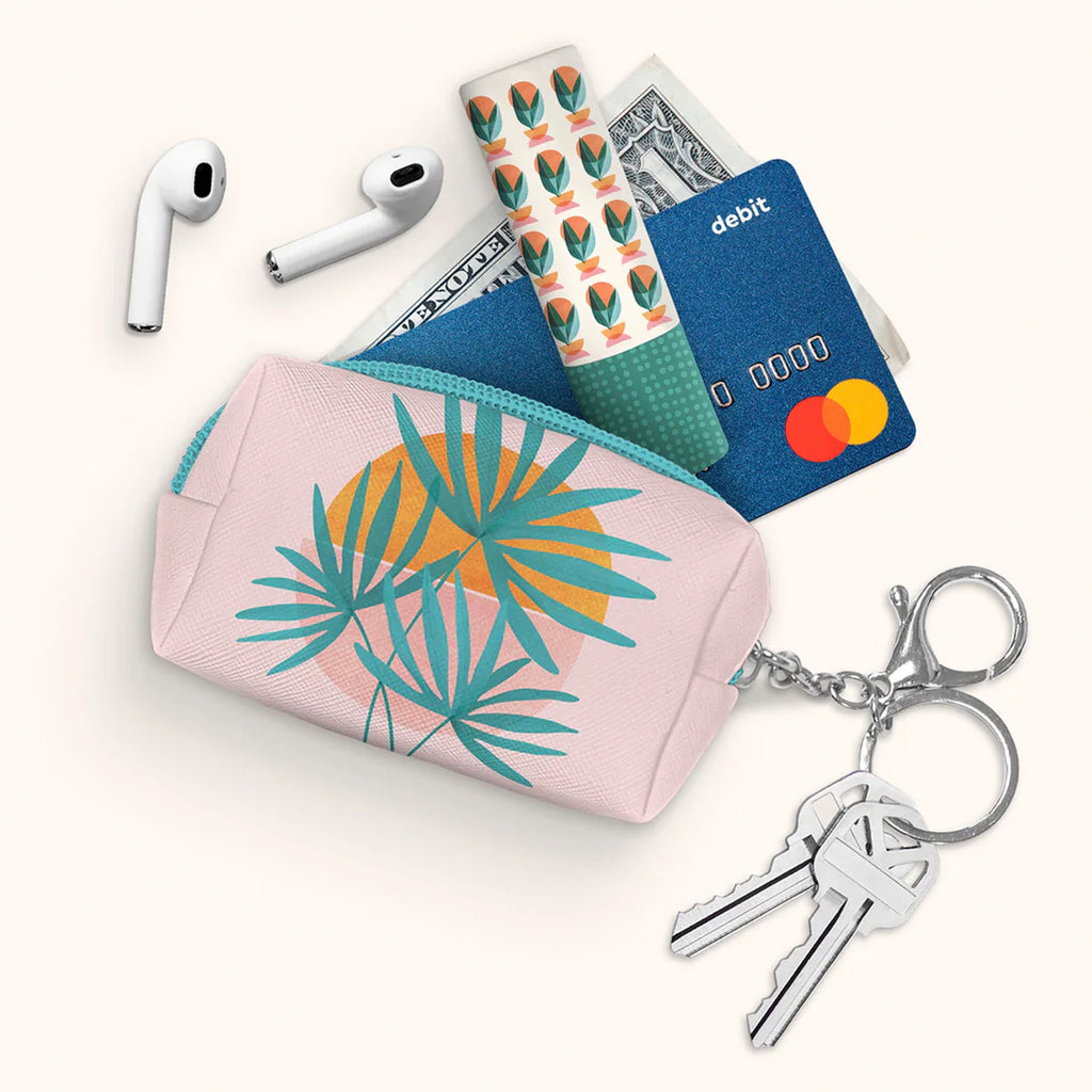 Island Sunset Key Chain Pouch filled with objects.