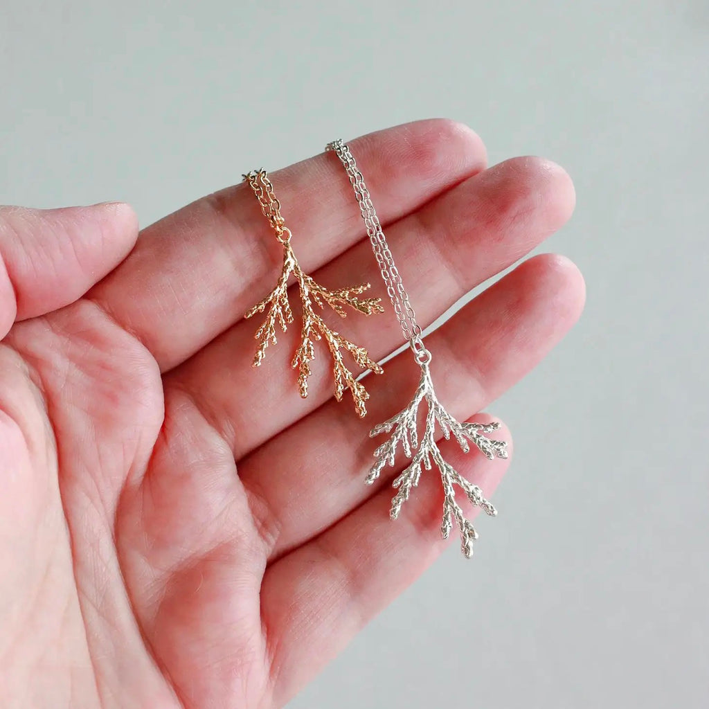 Juniper Branch Necklace hand holding.