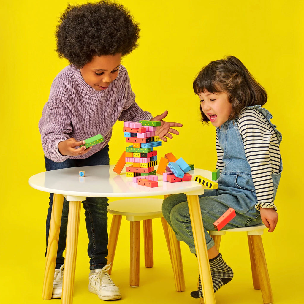 Kids playing with Stack-A-Bug Wooden Game.