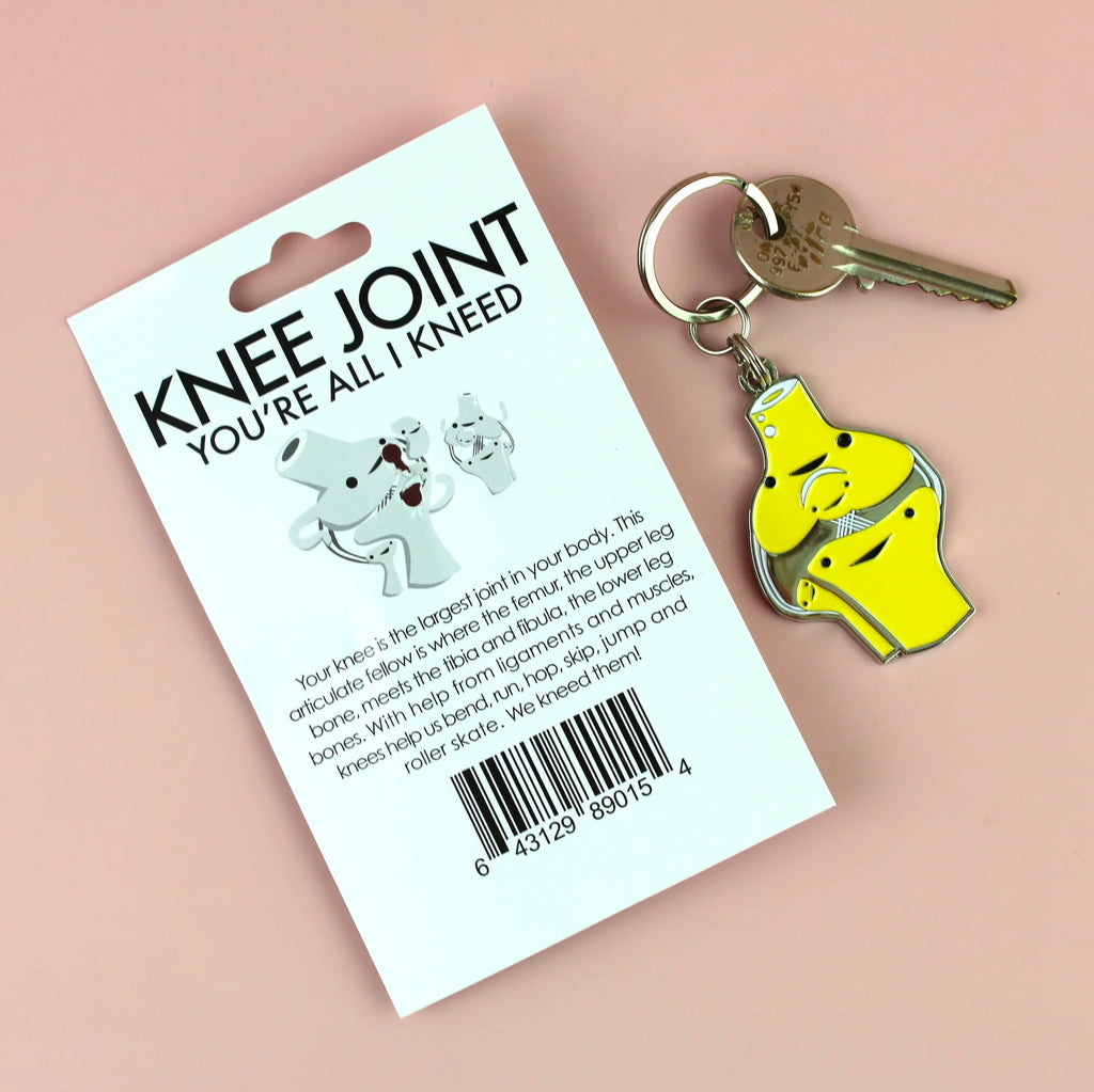 Knee Enamel Keychain back of packaging.