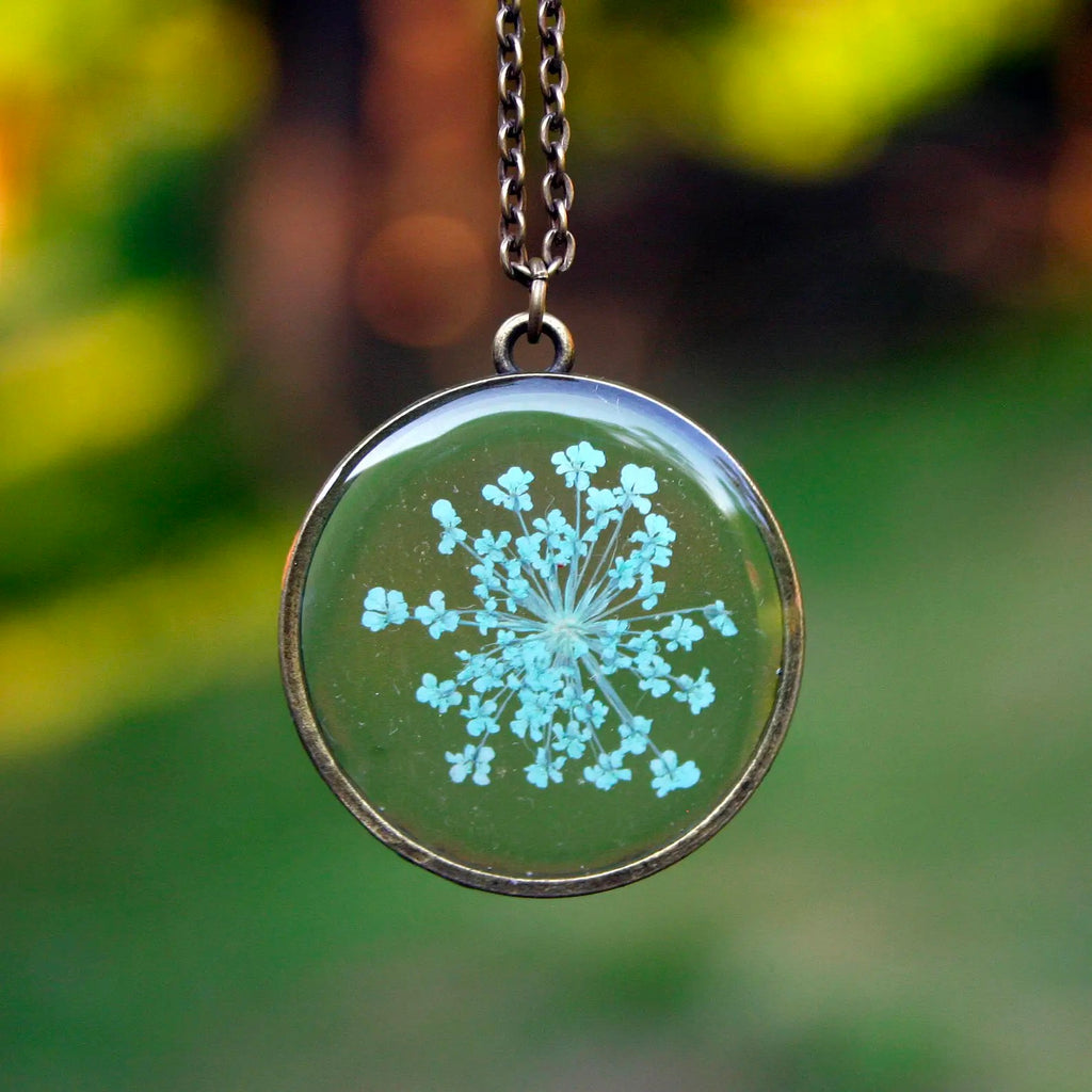 Light Blue Queen Anne's Lace Flower Necklace outdoors.