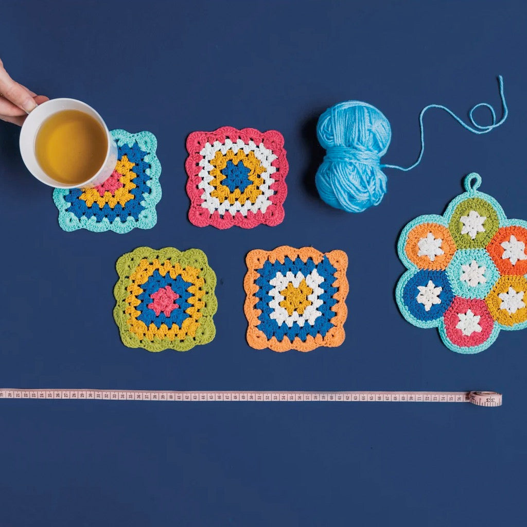 Loop De Loop Crochet Coasters on table.