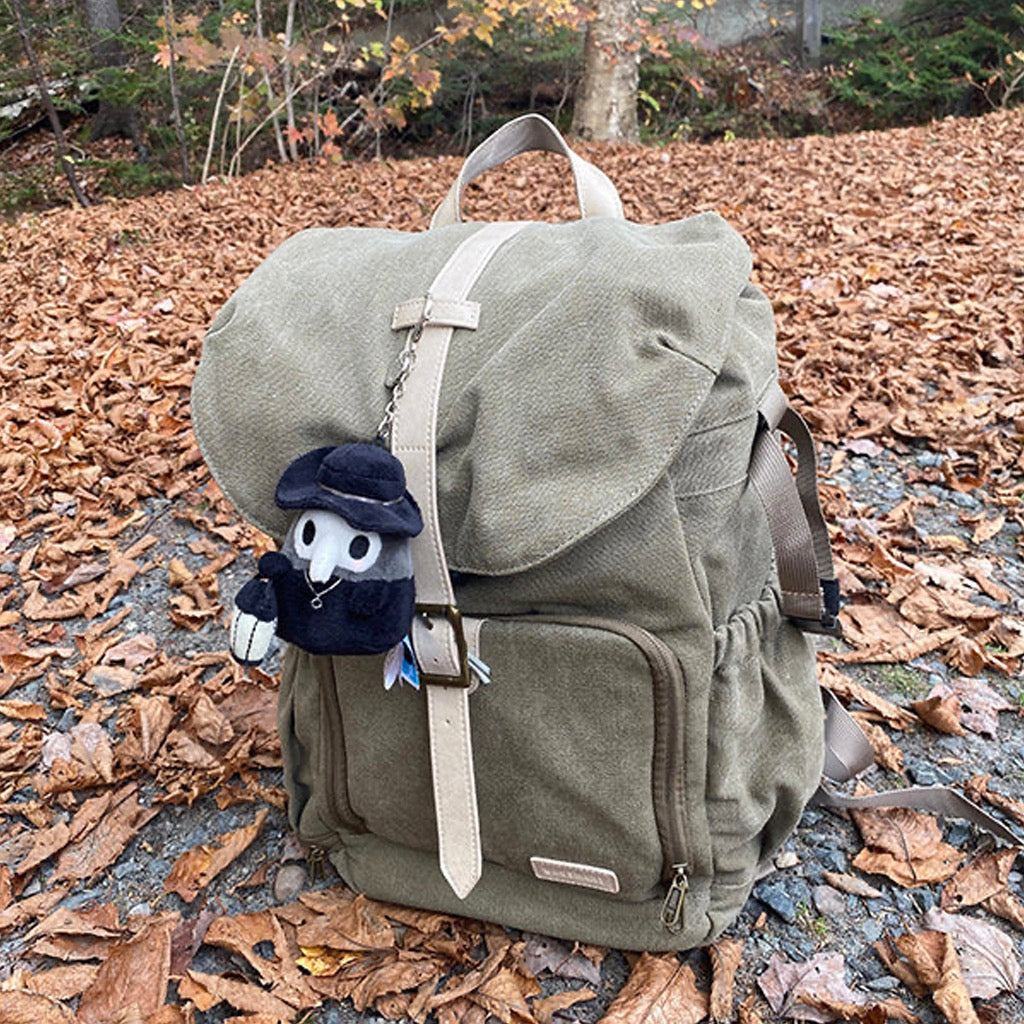 Micro Squishable Plague Doctor on knapsack.