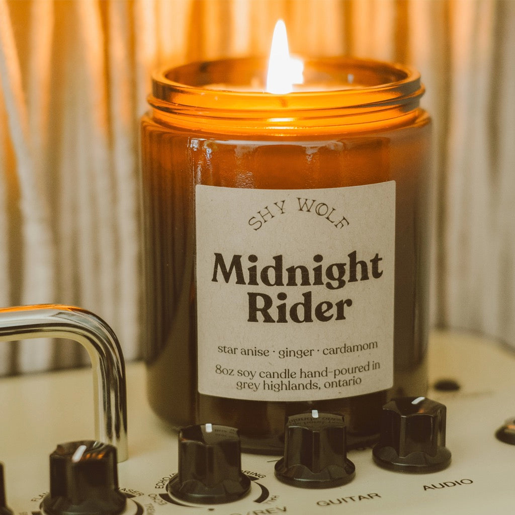 Midnight Rider Soy Wax Candle burning.