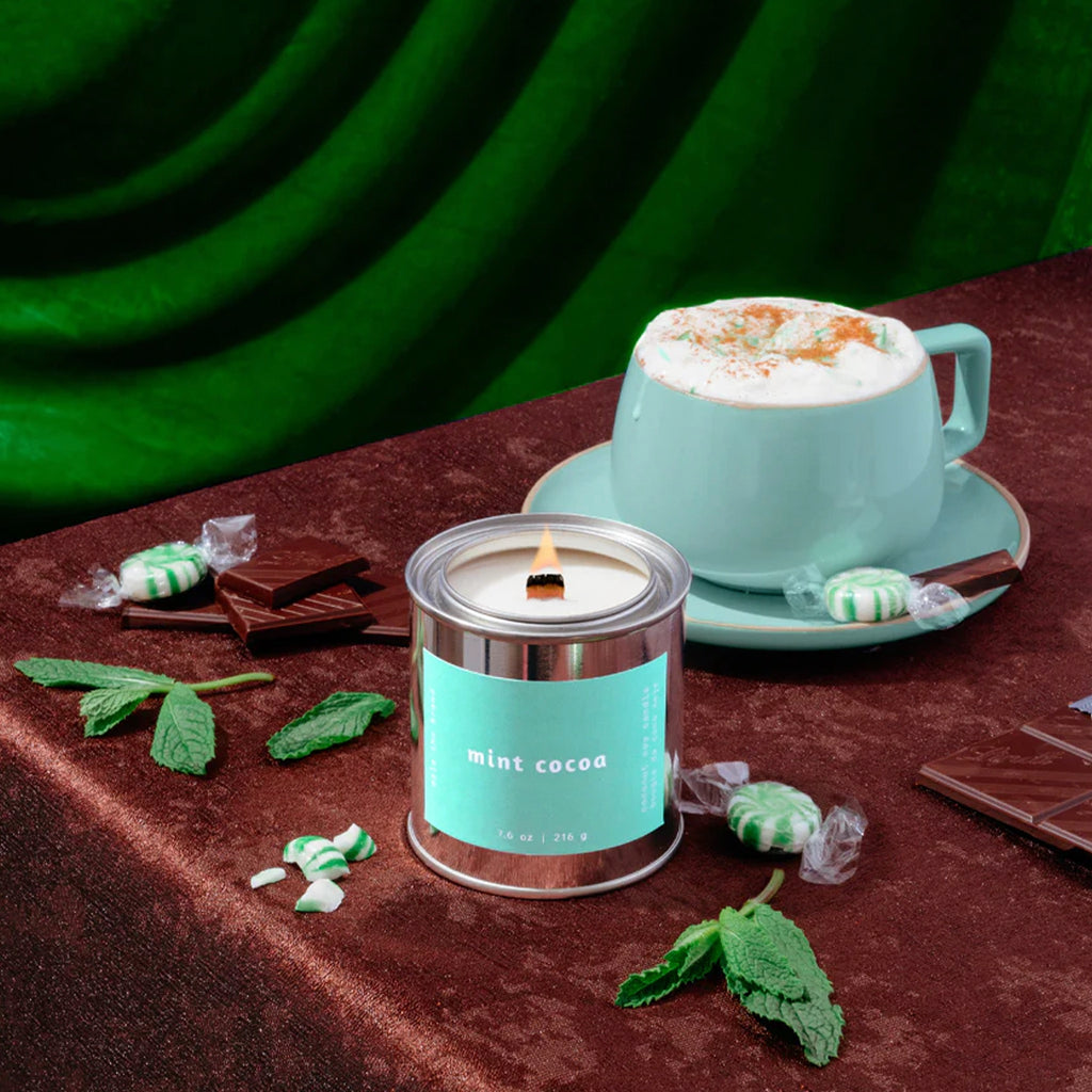 Mint Cocoa Candle on table.