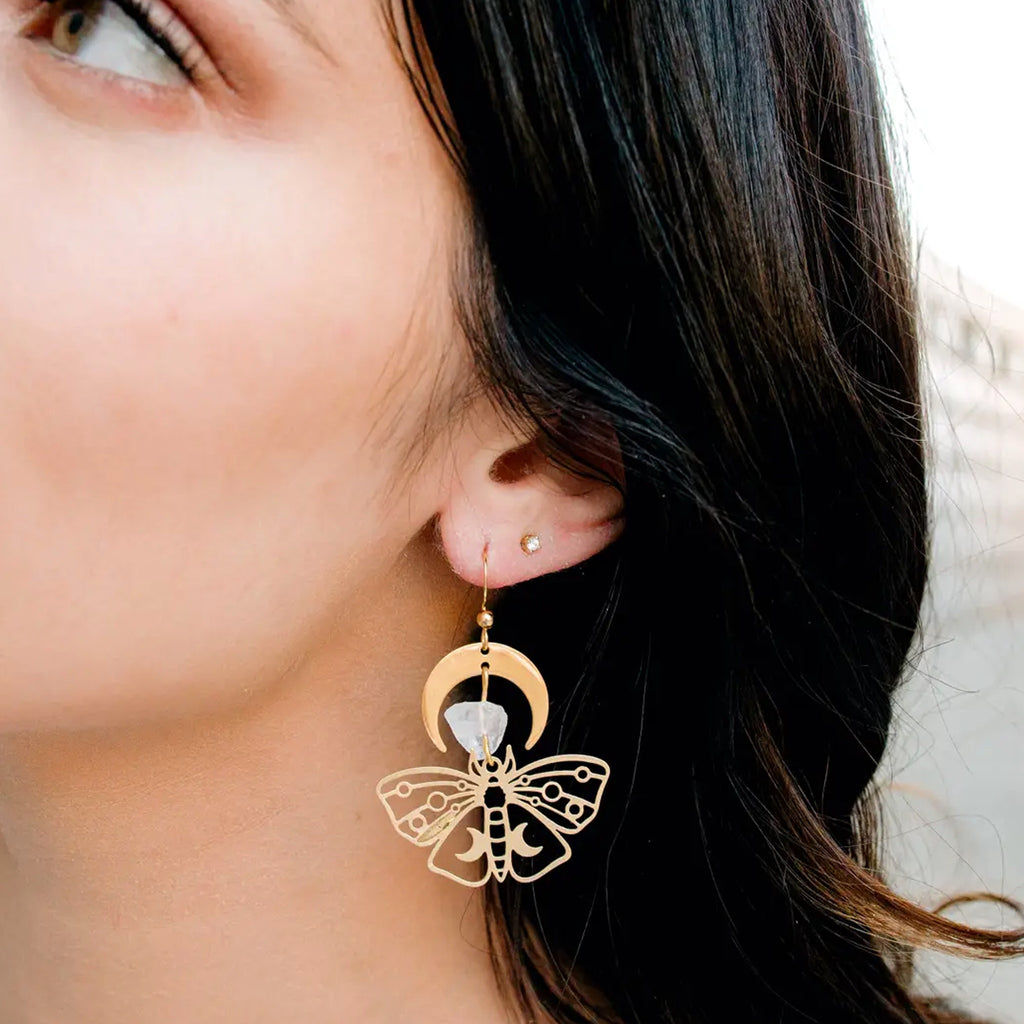 Mismatched Moth Earrings Person wearing.