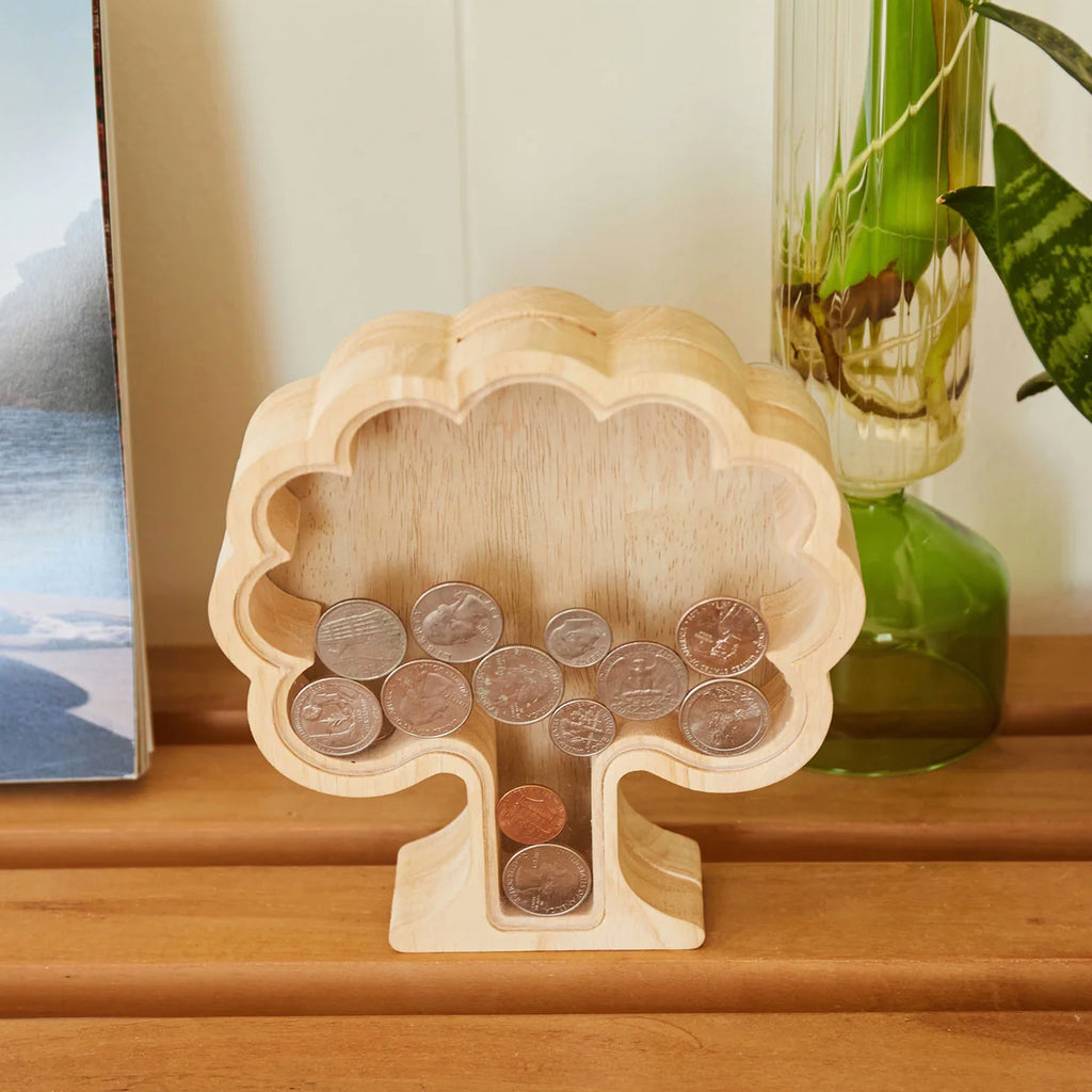 Money Tree Bank with coins in it.