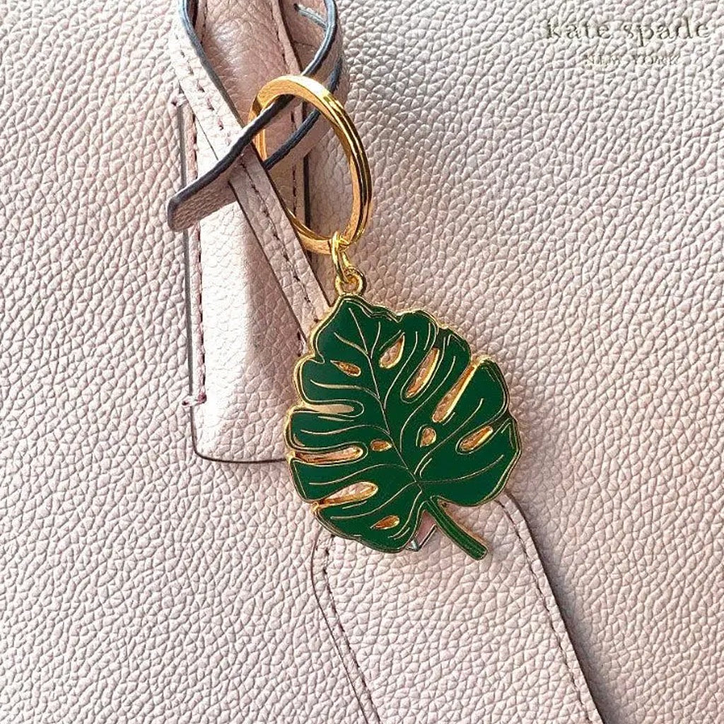 Monstera Leaf Keychain hanging on purse.