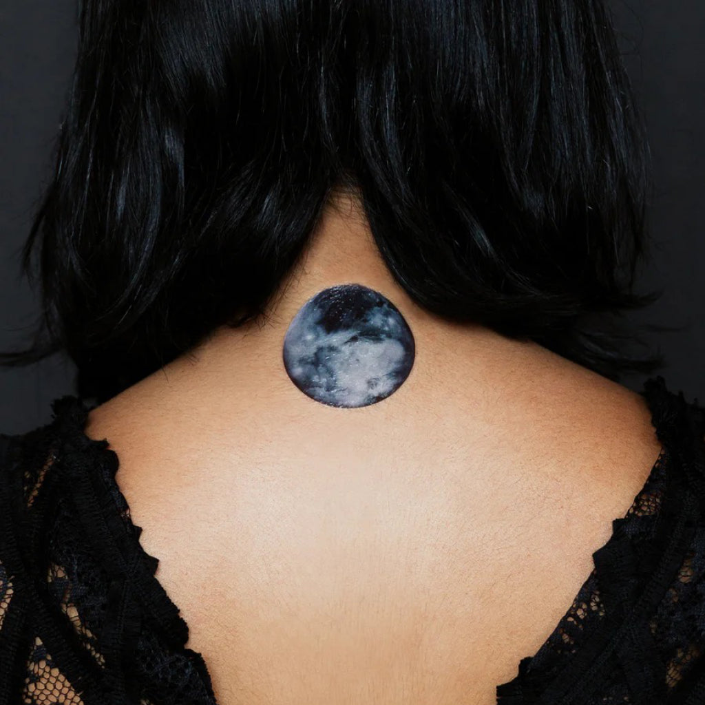 Moon Phases Tattoo on back of neck.