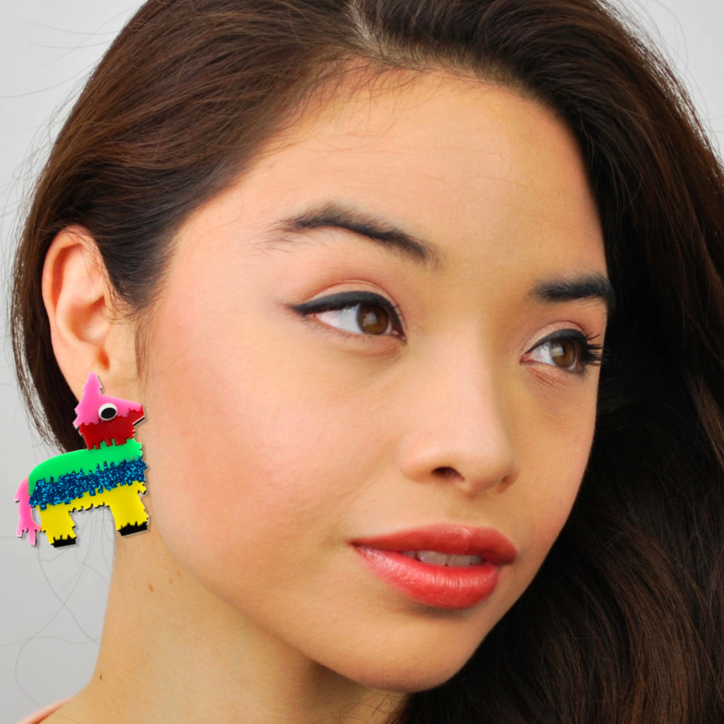 Multi Colored Pinata Earrings Person wearing.