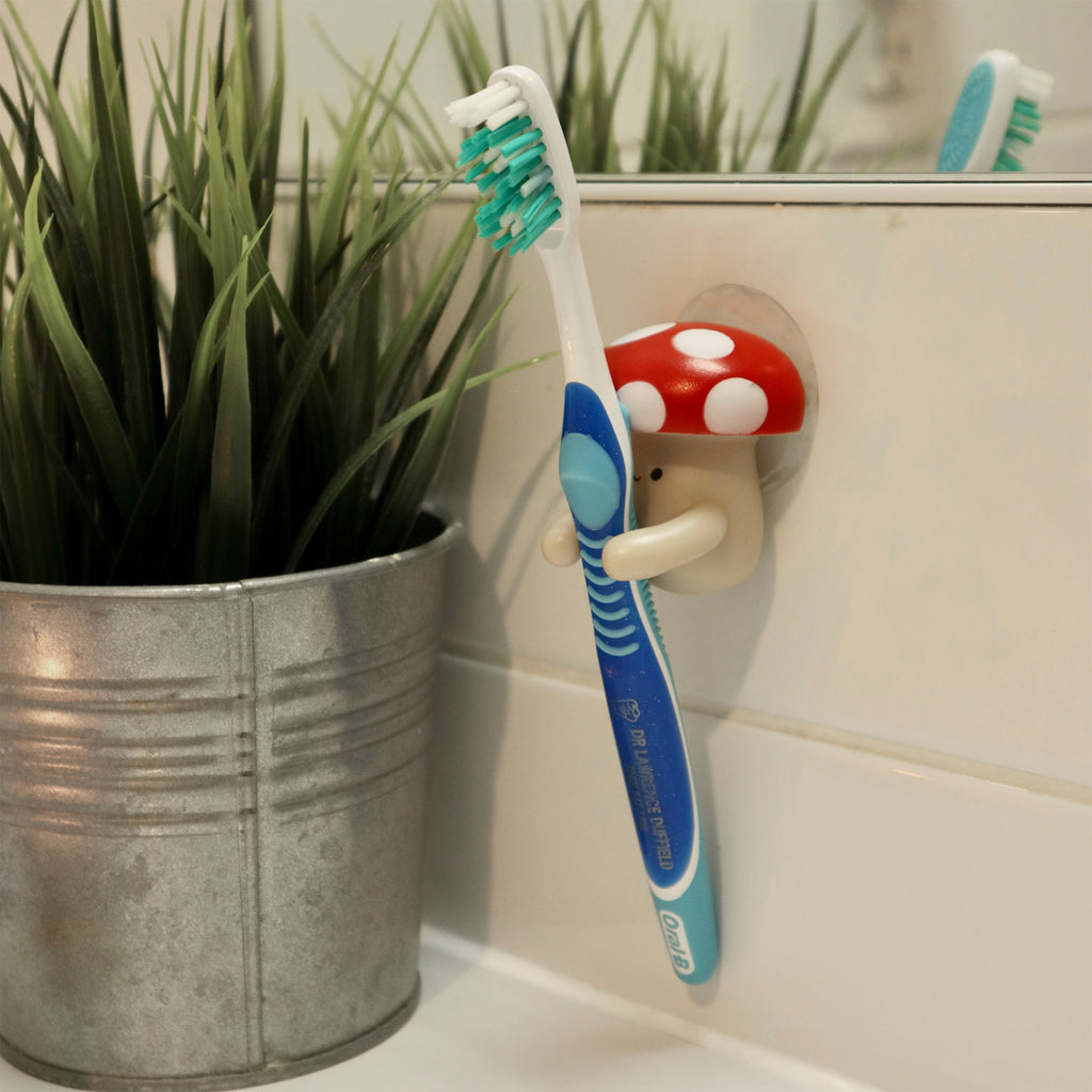 Mushroom Toothbrush Holder with toothbrush.