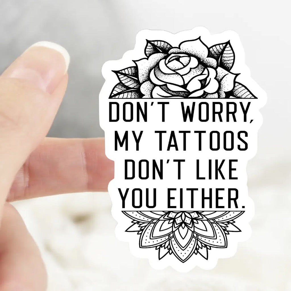 My Tattoos Don't Like You Either Sticker being held.