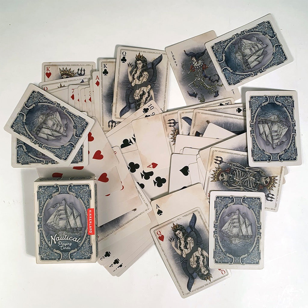 Nautical Playing Cards scattered.