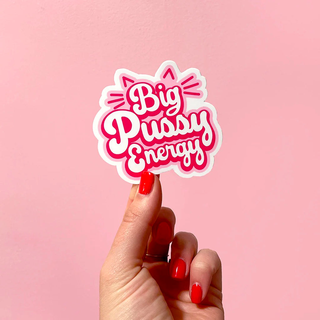 Person holding Big Pussy Energy Sticker.