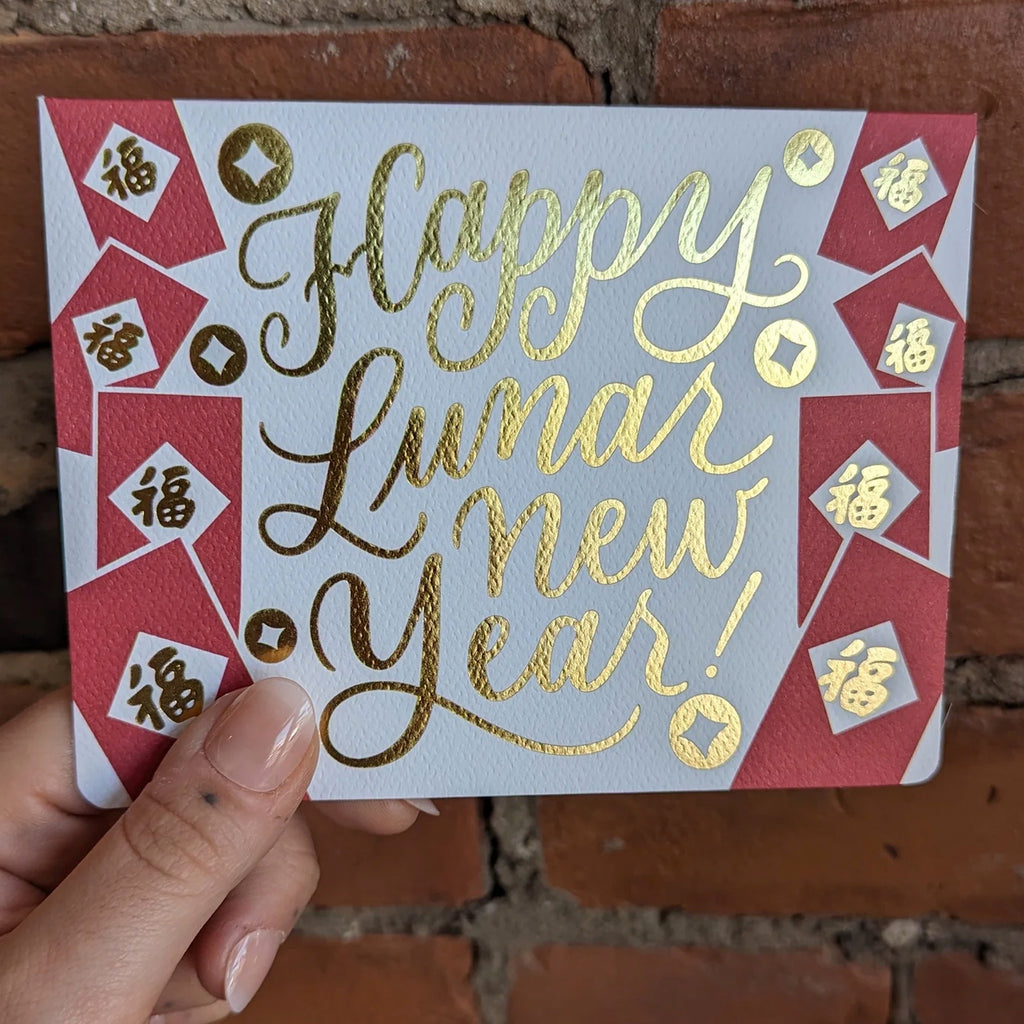 Person holding Lunar New Year Red Pockets Card.
