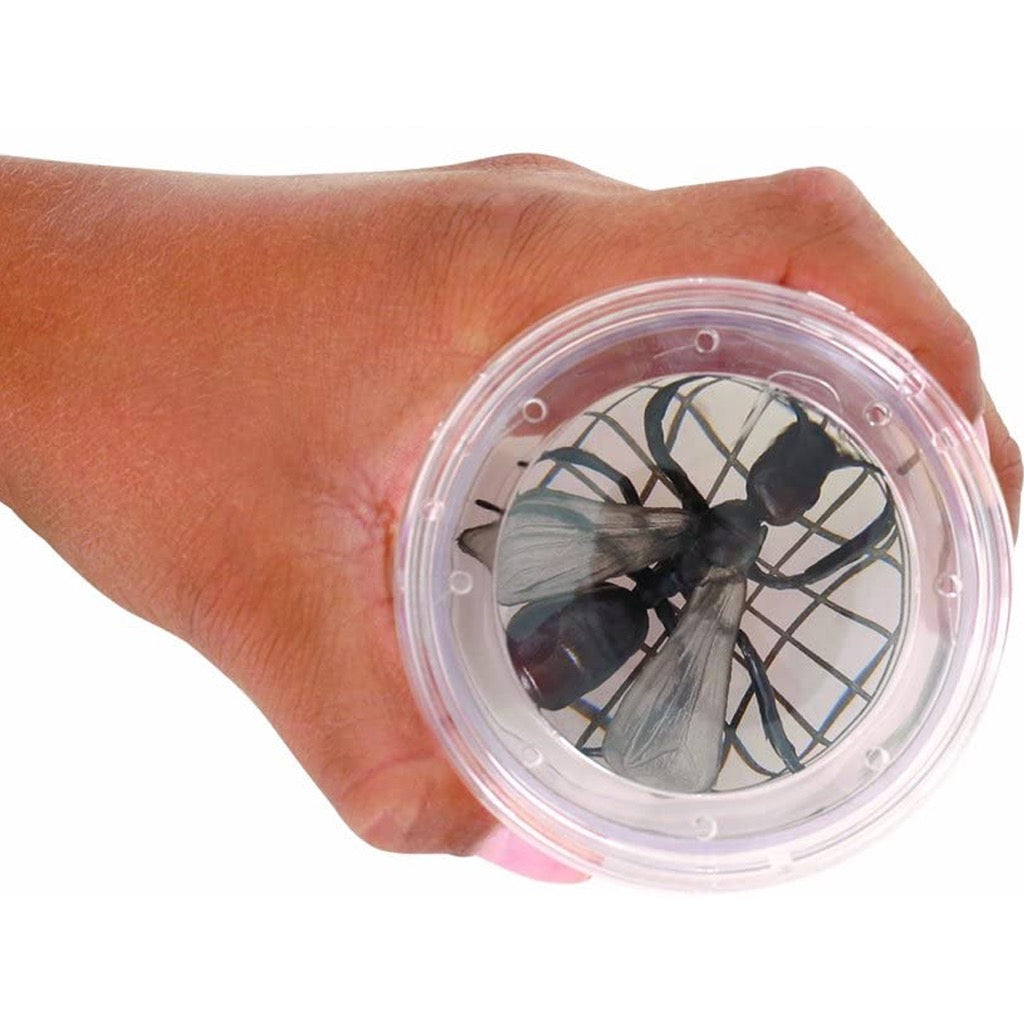 Person holding Magnifying Bug Viewer.