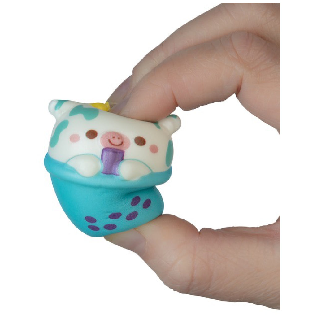 Person holding Orb Soft'n Slo Squishies Cafe Blind Bag.
