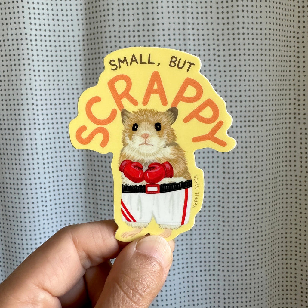 Person holding Small But Scrappy Hamster Sticker.