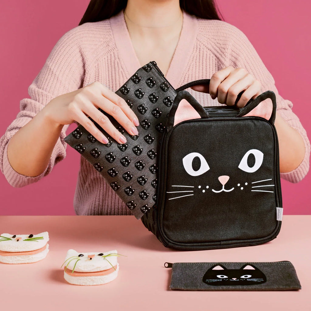 Person packing Daydream cat let's do lunch bag.