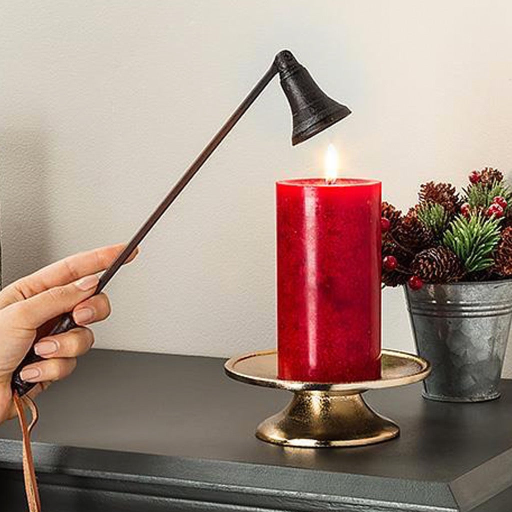 Person using Classic Candle Snuffer.