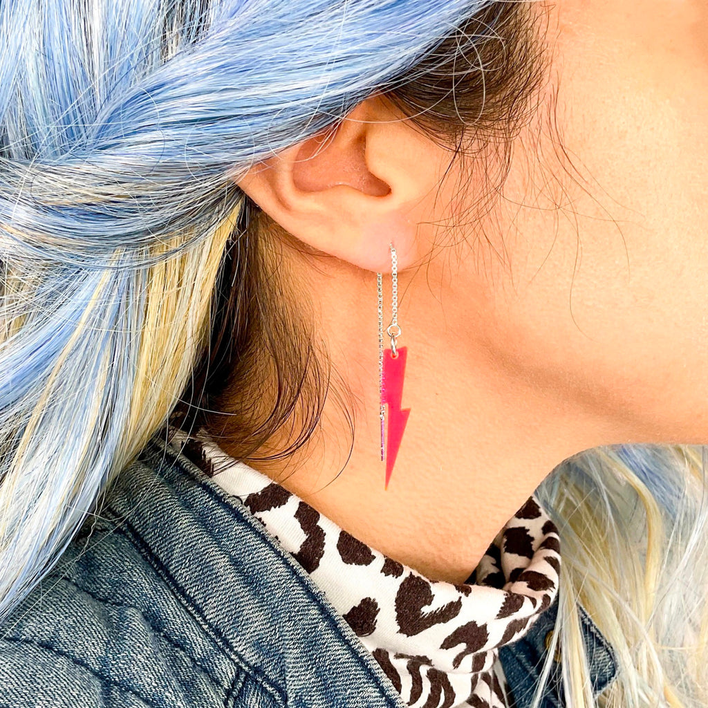 Person wearing Bright Baby Bolts Ear Threaders Pink.