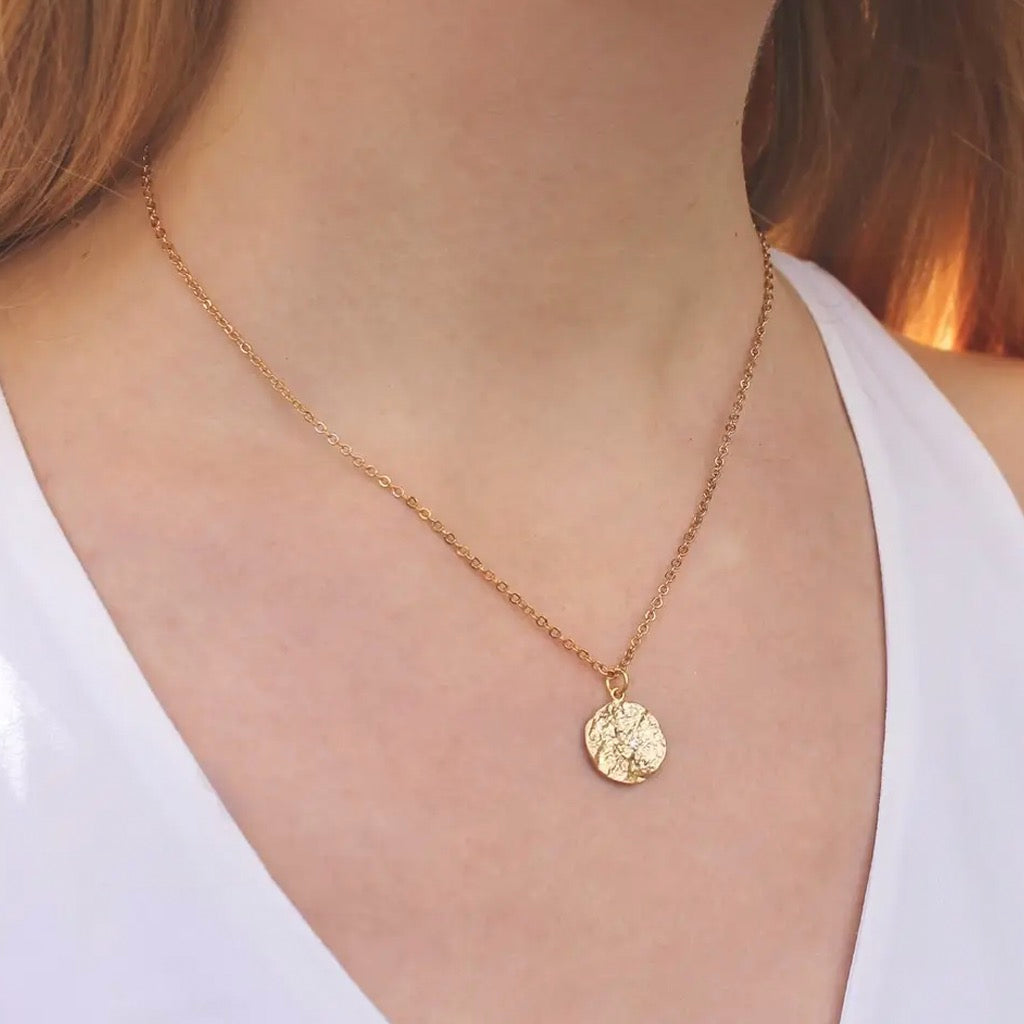 Person wearing Crinkle Crystal Disc Necklace.
