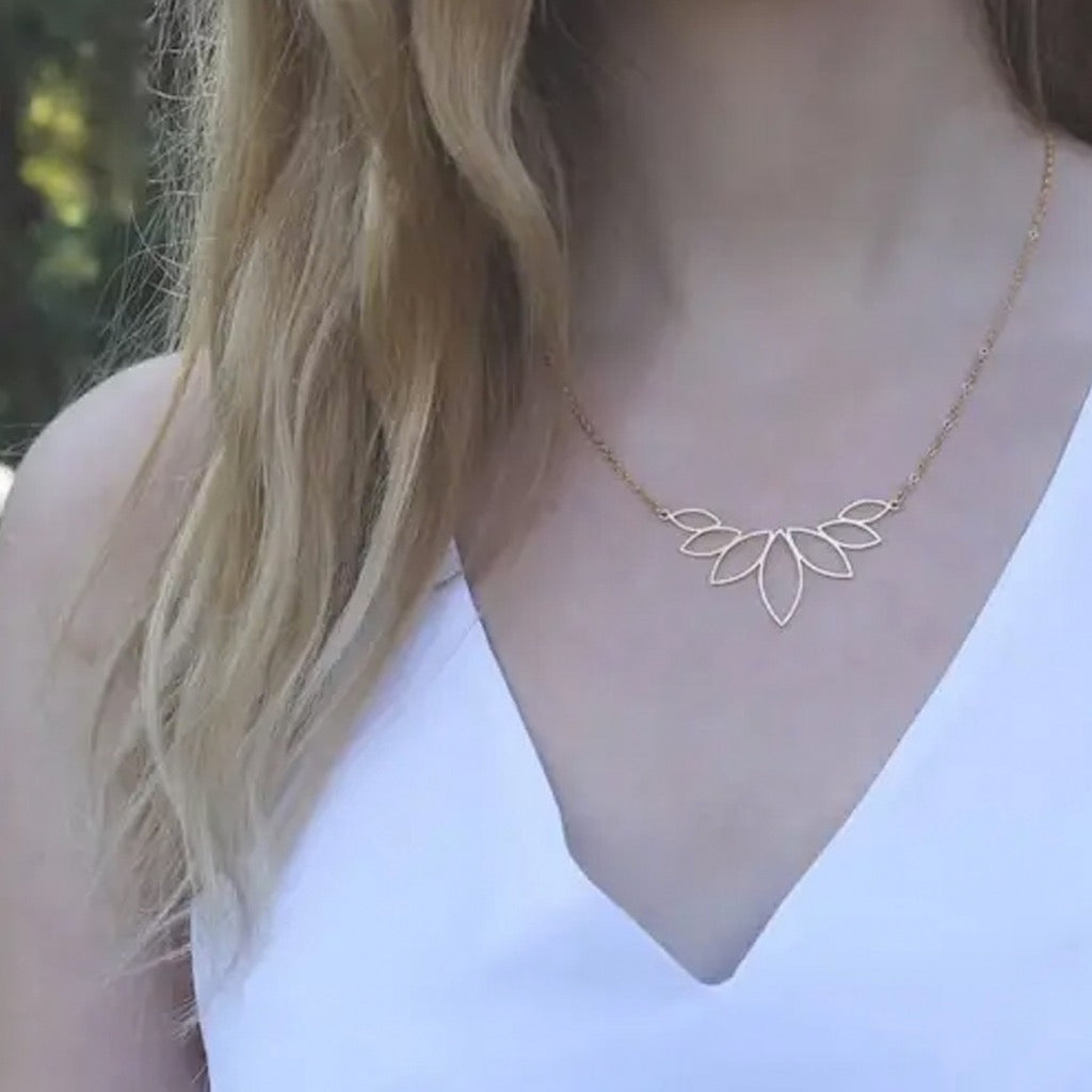 Person wearing Gold Lotus Necklace.
