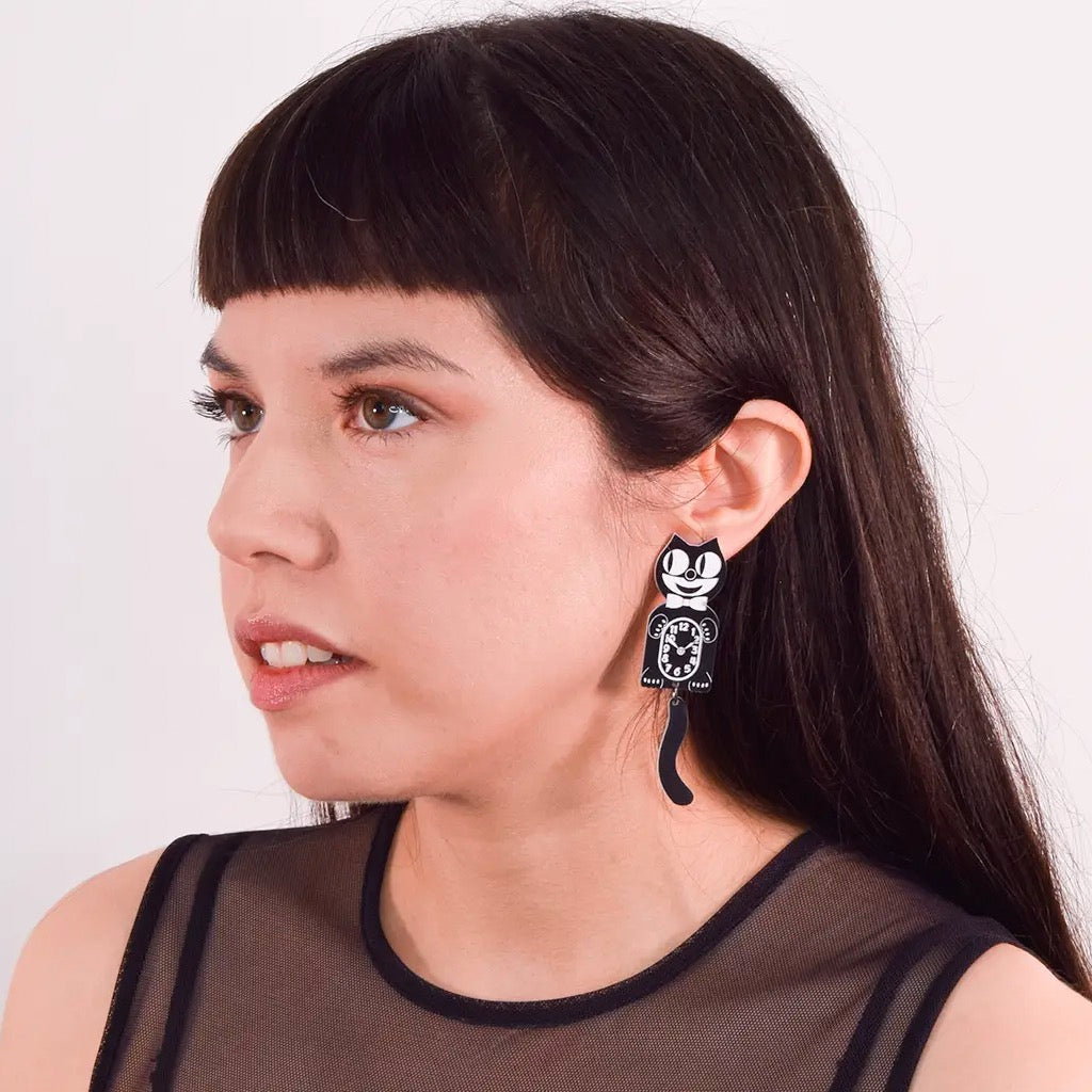 Person wearing Kit-Kat Clock Earrings.