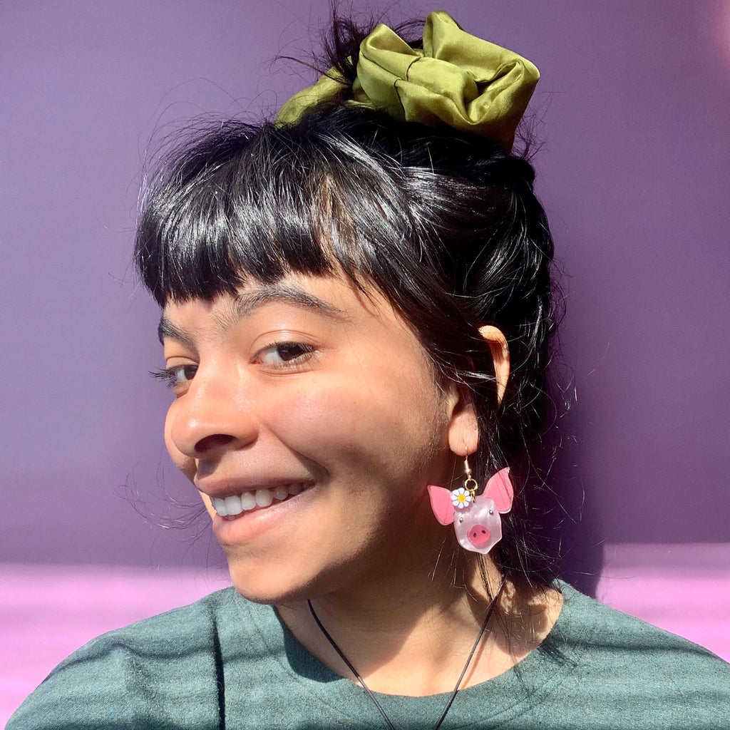 Person wearing Little Piggies Earrings.