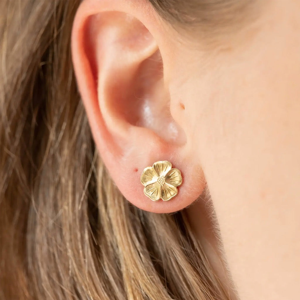 Person wearing Mini Flower Studs.