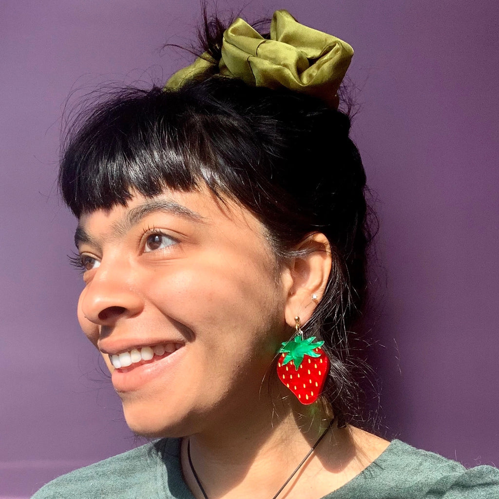 Person wearing Strawberry Earrings.