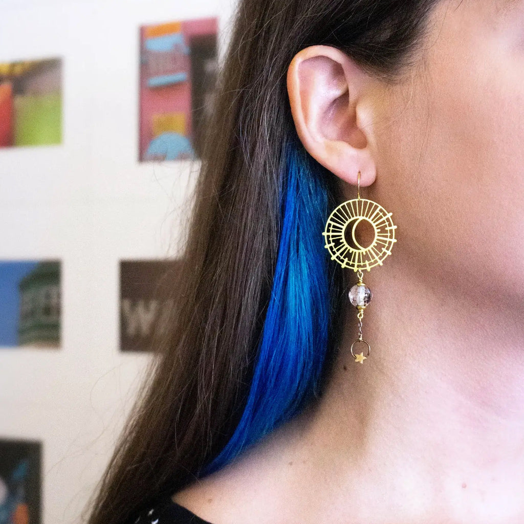 Person wearing Sun and Moon Earrings with Vintage Clear Star Beads.