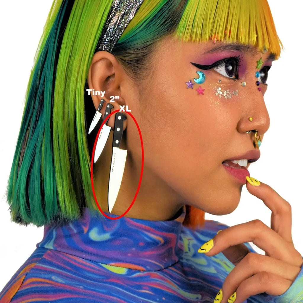 Person wearing XL Knife Earrings.