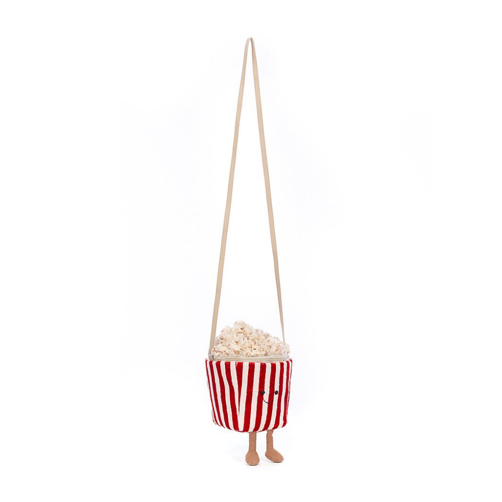 Popcorn handbag with strap extended.