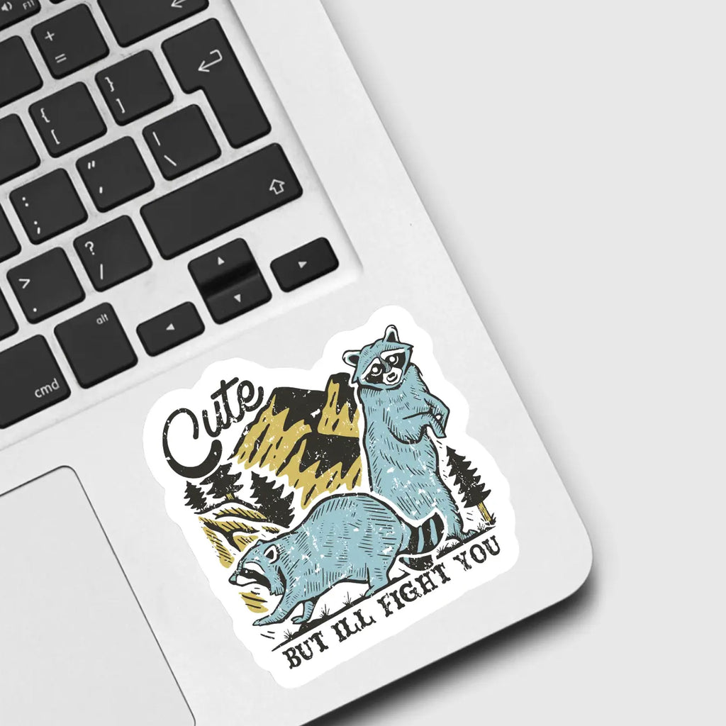 Raccoon Cute But I'll Fight You Sticker on computer.