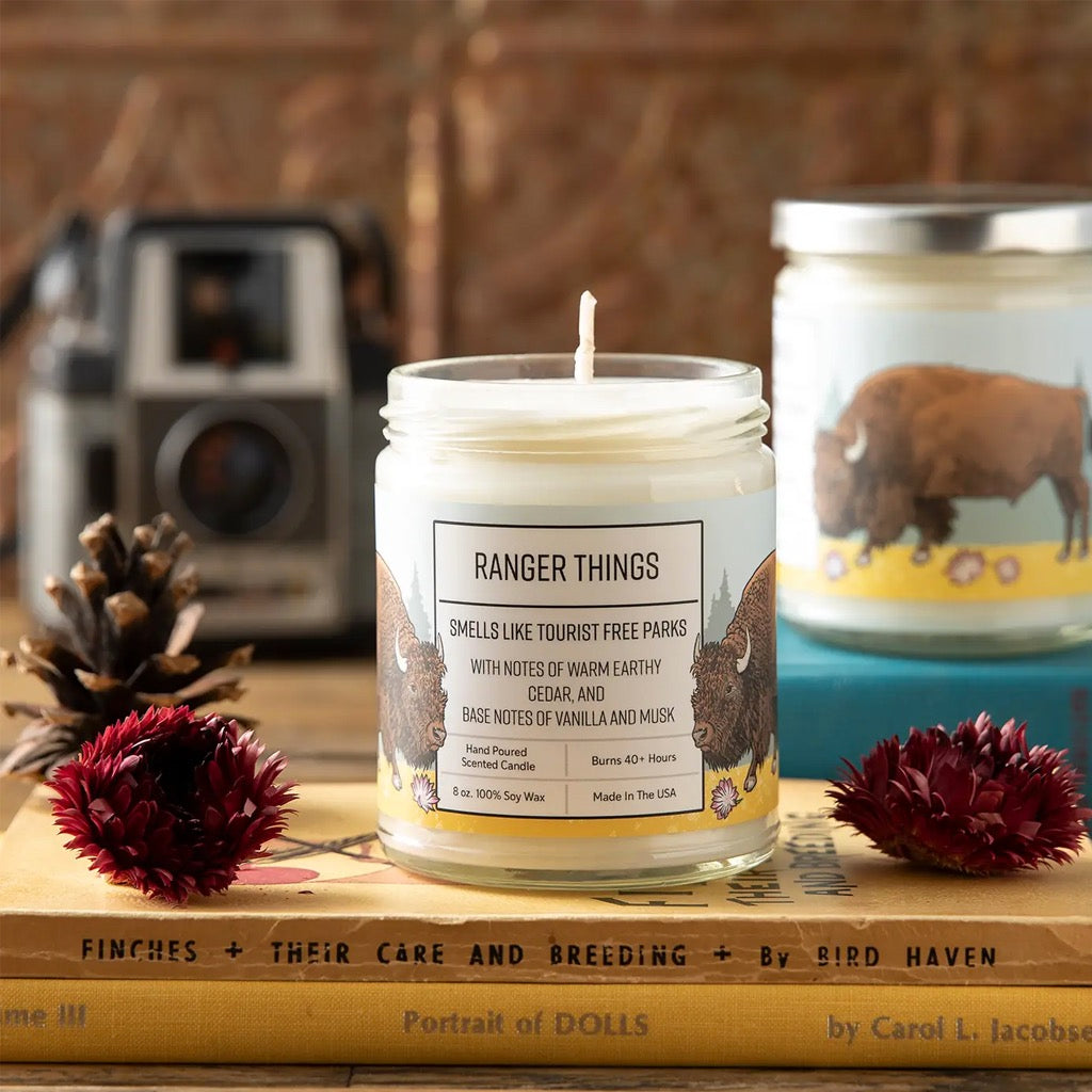 Ranger Things 8oz Soy Candle on book.