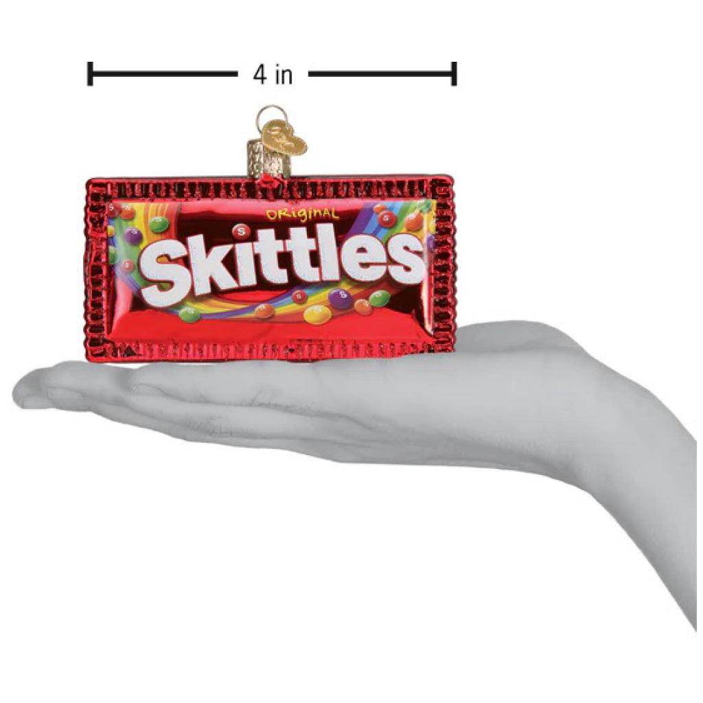 Skittles Ornament being held.